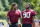Washington Commanders defensive ends Chase Young, left, and Montez Sweat walk together after practice at the team's NFL football training facility, Thursday, Aug. 11, 2022, in Ashburn, Va. (AP Photo/Alex Brandon)