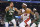 Miami Heat forward Jimmy Butler (22) drives against Milwaukee Bucks forward Giannis Antetokounmpo (34) during the first half of Game 5 in a first-round NBA basketball playoff series Wednesday, April 26, 2023, in Milwaukee. (AP Photo/Jeffrey Phelps)
