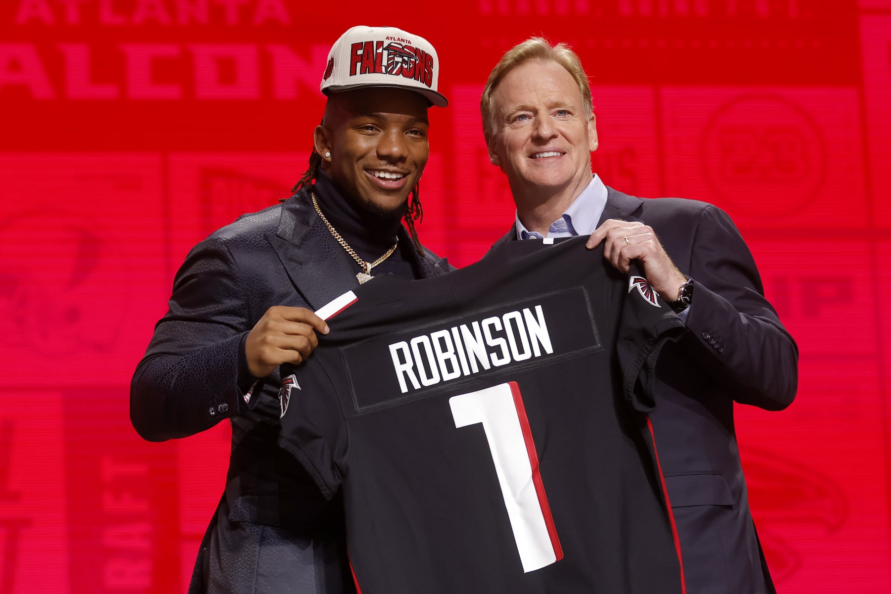 Football KANSAS CITY, MISSOURI - APRIL 27: (L-R) Bijan Robinson poses with NFL Commissioner Roger Goodell after being selected eighth overall by the Atlanta Falcons during the first round of the 2023 NFL Draft at Union Station on April 27, 2023 in Kansas City, Missouri. (Photo by David Eulitt/Getty Images)