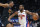 Detroit Pistons guard Alec Burks (5) drives against Cleveland Cavaliers forward Isaac Okoro during the first half of an NBA basketball game Sunday, Nov. 27, 2022, in Detroit. (AP Photo/Duane Burleson)