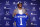 Indianapolis Colts first-round draft pick Anthony Richardson hold a Colts jersey following a news conference at the NFL football team's practice facility in Indianapolis, Friday, April 28, 2023. (AP Photo/Michael Conroy)