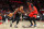 PORTLAND, OREGON - NOVEMBER 15: Damian Lillard #0 of the Portland Trail Blazers dribbles against Pascal Siakam #43 of the Toronto Raptors during the first quarter at Moda Center on November 15, 2021 in Portland, Oregon.  NOTE TO USER: User expressly acknowledges and agrees that, by downloading and or using this photograph, User is consenting to the terms and conditions of the Getty Images License Agreement. (Photo by Abbie Parr/Getty Images)