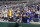 New York Mets fans react after it was announced, after a nearly four-hour weather delay, that the day's baseball game would resume Sunday as part of a doubleheader against the Washington Nationals at Nationals Park, Saturday, May 13, 2023, in Washington. (AP Photo/Alex Brandon)