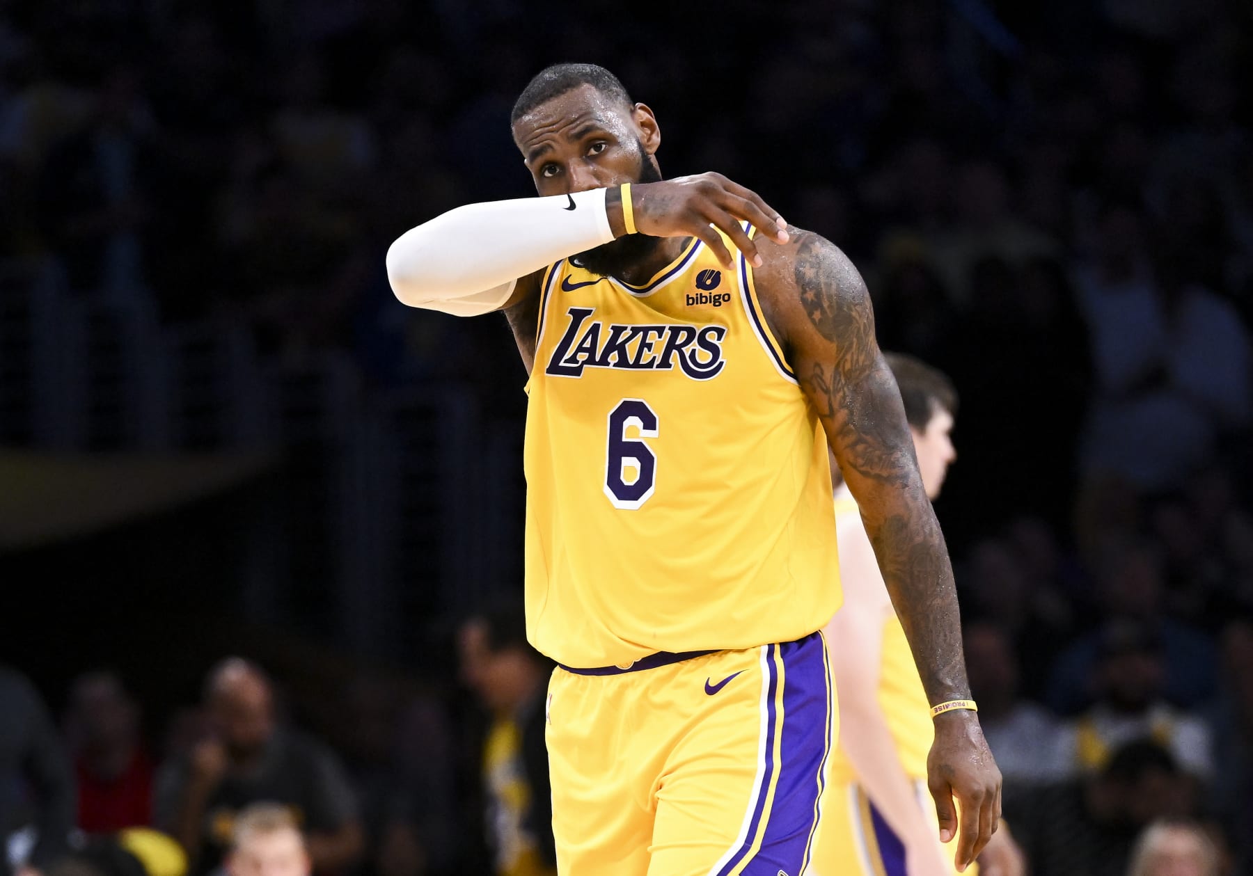 LOS ANGELES, CA - MAY 22: Los Angeles Lakers forward LeBron James wipes his face during the fourth quarter of game four in the NBA Playoffs Western Conference Finals against the Denver Nuggets at Crypto.com Arena on Monday, May 22, 2023 in Los Angeles, CA. (Wally Skalij / Los Angeles Times via Getty Images)