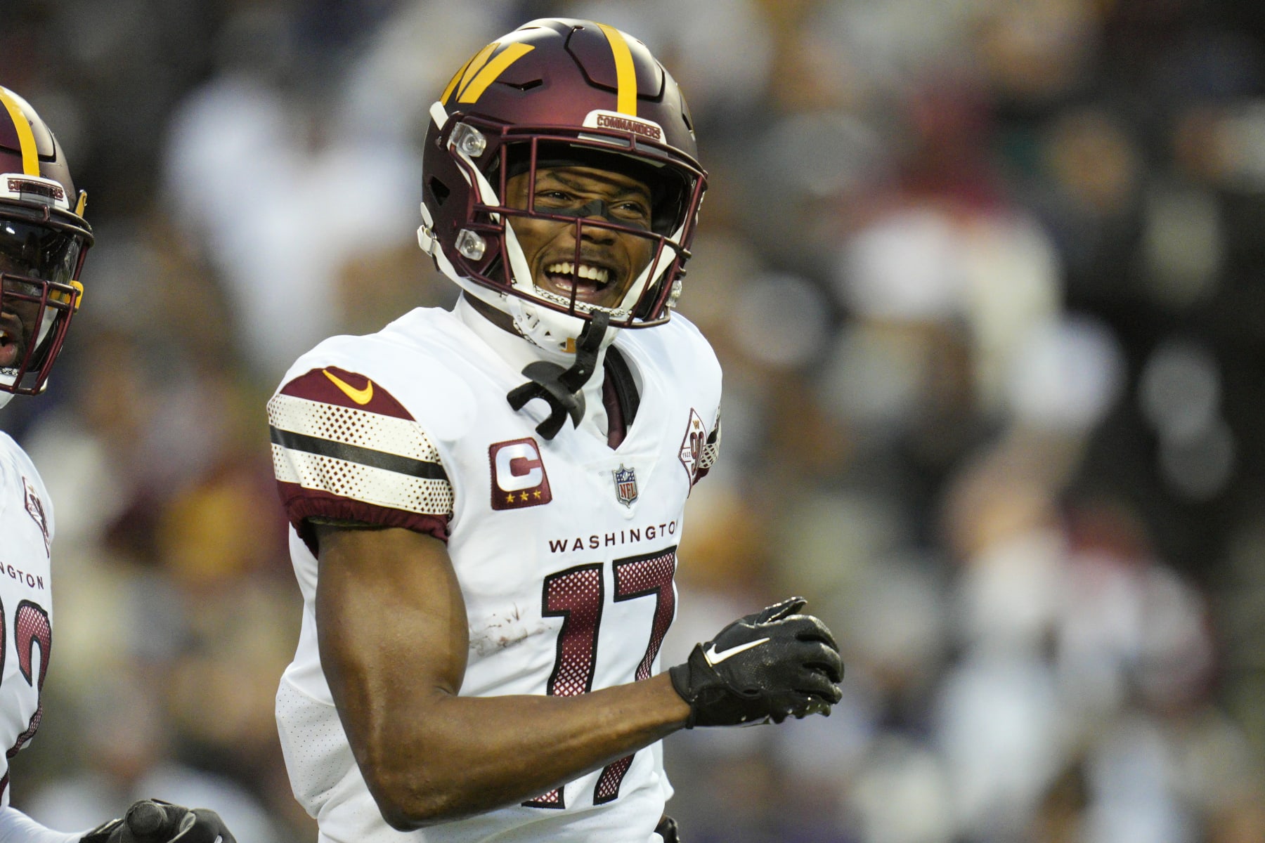 LANDOVER, MARYLAND - JANUARY 08: Terry McLaurin #17 of the Washington Commanders celebrates after scoring a touchdown against the Dallas Cowboys during the first half at FedExField on January 08, 2023 in Landover, Maryland. (Photo by Jess Rapfogel/Getty Images)