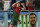 TOPSHOT - Portugal forward #07 Cristiano Ronaldo celebrates after scoring his team's first goal from the penalty spot while a banner depicting Argentine forward Lionel Messi is seen in the background during the Qatar 2022 World Cup Group H football match between Portugal and Ghana at Stadium 974 in Doha on November 24, 2022. (Photo by MANAN VATSYAYANA / AFP) (Photo by MANAN VATSYAYANA/AFP via Getty Images)
