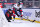 RALEIGH, NORTH CAROLINA - FEBRUARY 18: Brett Pesce #22 of the Carolina Hurricanes and Evgeny Kuznetsov #92 of the Washington Capitals compete for the puck during the second period in the 2023 Navy Federal Credit Union NHL Stadium Series at Carter-Finley Stadium on February 18, 2023 in Raleigh, North Carolina. (Photo by Grant Halverson/Getty Images)