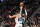 PORTLAND, OREGON - DECEMBER 10: Damian Lillard #0 of the Portland Trail Blazers shoots a three point basket against Austin Rivers #25 of the Minnesota Timberwolves during the second quarter at the Moda Center on December 10, 2022 in Portland, Oregon. NOTE TO USER: User expressly acknowledges and agrees that, by downloading and or using this photograph, User is consenting to the terms and conditions of the Getty Images License Agreement. (Photo by Alika Jenner/Getty Images)