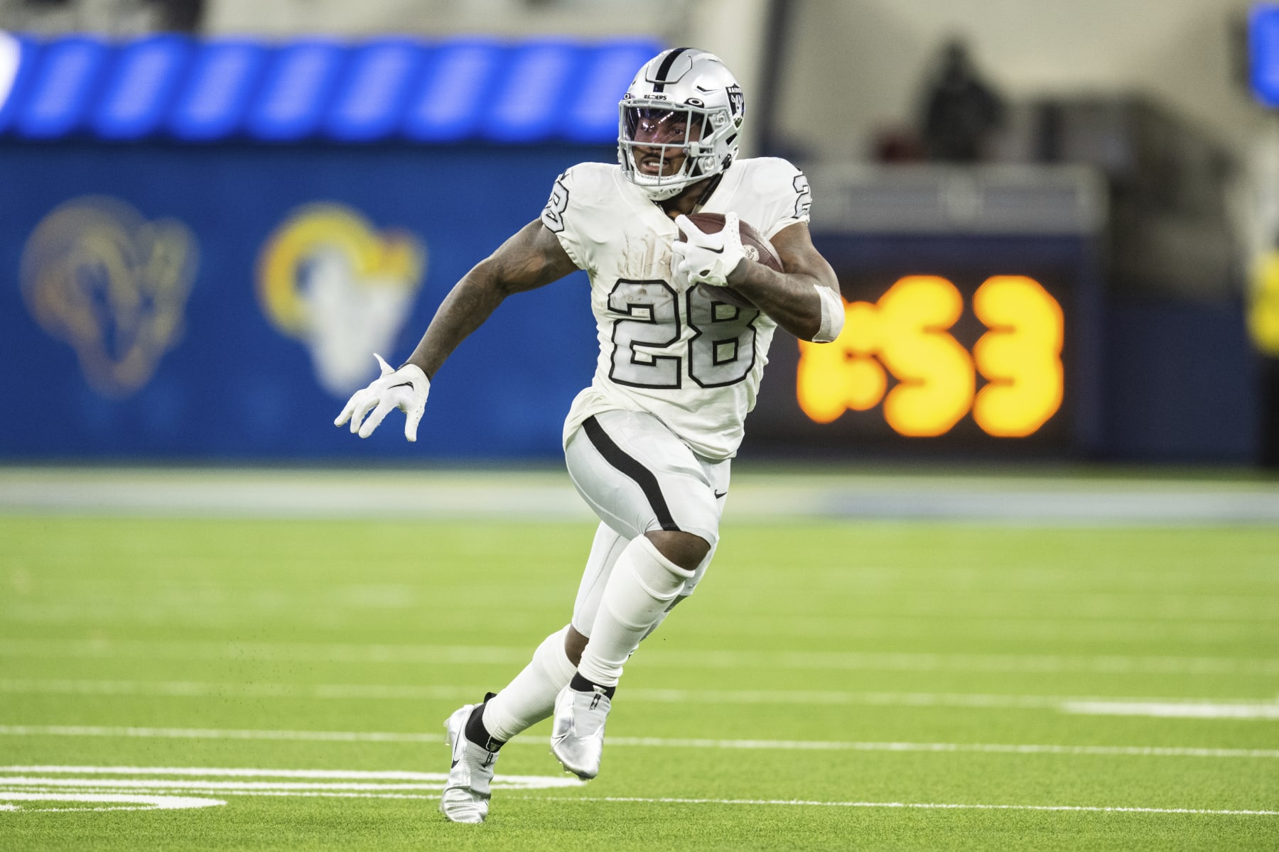 Las Vegas Raiders running reduction Josh Jacobs (28) runs with the ball all the map in which thru an NFL football sport against the Los Angeles Rams, Thursday, Dec. 8, 2022, in Inglewood, Calif. (AP Photograph/Kyusung Gong)