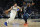 Dallas Mavericks guard Luka Doncic (77) works towards the basket against Minnesota Timberwolves guard Anthony Edwards (1) during the second half of an NBA basketball game, Wednesday, Dec. 21, 2022, in Minneapolis. (AP Photo/Abbie Parr)
