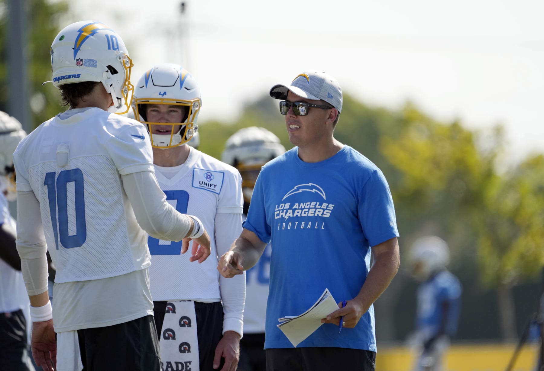 Justin Herbert (left) and Kellen Moore (right)