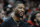 PORTLAND, OREGON - MARCH 24: Damian Lillard #0 of the Portland Trail Blazers watches from the bench during the second half against the Chicago Bulls at Moda Center on March 24, 2023 in Portland, Oregon. NOTE TO USER: User expressly acknowledges and agrees that, by downloading and or using this photograph, User is consenting to the terms and conditions of the Getty Images License Agreement. (Photo by Soobum Im/Getty Images)