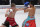 TOKYO, JAPAN - DECEMBER 14: Naoya Inoue (L) of Japan punches Aran Dipaen of Thailand during the WBA Super Bantamweight and IBO Bantamweight title bout at Ryogoku Kokugikan on December 14, 2021 in Tokyo, Japan. (Photo by Toru Hanai/Getty Images)