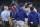 TORONTO, CANADA - SEPTEMBER 12: Max Scherzer #31 of the Texas Rangers meets with trainers and coaches on the mound before leaving the game in the sixth inning against the Toronto Blue Jays at Rogers Centre on September 12, 2023 in Toronto, Canada. (Photo by Cole Burston/Getty Images)