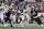 FOXBOROUGH, MA - SEPTEMBER 10: Philadelphia Eagles quarterback Jalen Hurts (1) escapes from New England Patriots defensive end Christian Barmore (90) and Ndefensive end Keion White (99) during a game between the New England Patriots and the Philadelphia Eagles on September 10, 2023, at Gillette Stadium in Foxborough, Massachusetts. (Photo by Fred Kfoury III/Icon Sportswire via Getty Images)