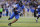 LEXINGTON, KENTUCKY - NOVEMBER 26: Trevin Wallace #32 of the Kentucky Wildcats runs with the ball after intercepting a pass against the Louisville Cardinals at Kroger Field on November 26, 2022 in Lexington, Kentucky. (Photo by Andy Lyons/Getty Images)