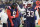 ARLINGTON, TEXAS - OCTOBER 01: Matthew Judon #9 of the New England Patriots holds his arm while walking off the field while consoled by Anfernee Jennings #33 of the New England Patriots during the third quarter against the Dallas Cowboys at AT&T Stadium on October 01, 2023 in Arlington, Texas. (Photo by Sam Hodde/Getty Images)