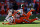 DENVER, COLORADO - OCTOBER 08: Alex Singleton #49 and Damarri Mathis #27 of the Denver Broncos tackle Tyler Conklin #83 of the New York Jets in the fourth quarter at Empower Field At Mile High on October 08, 2023 in Denver, Colorado. (Photo by Matthew Stockman/Getty Images)