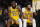 Los Angeles Lakers forward LeBron James, left, and forward Anthony Davis sit on the bench in the closing seconds of an NBA basketball game against the Sacramento Kings Wednesday, Nov. 15, 2023, in Los Angeles. (AP Photo/Mark J. Terrill)