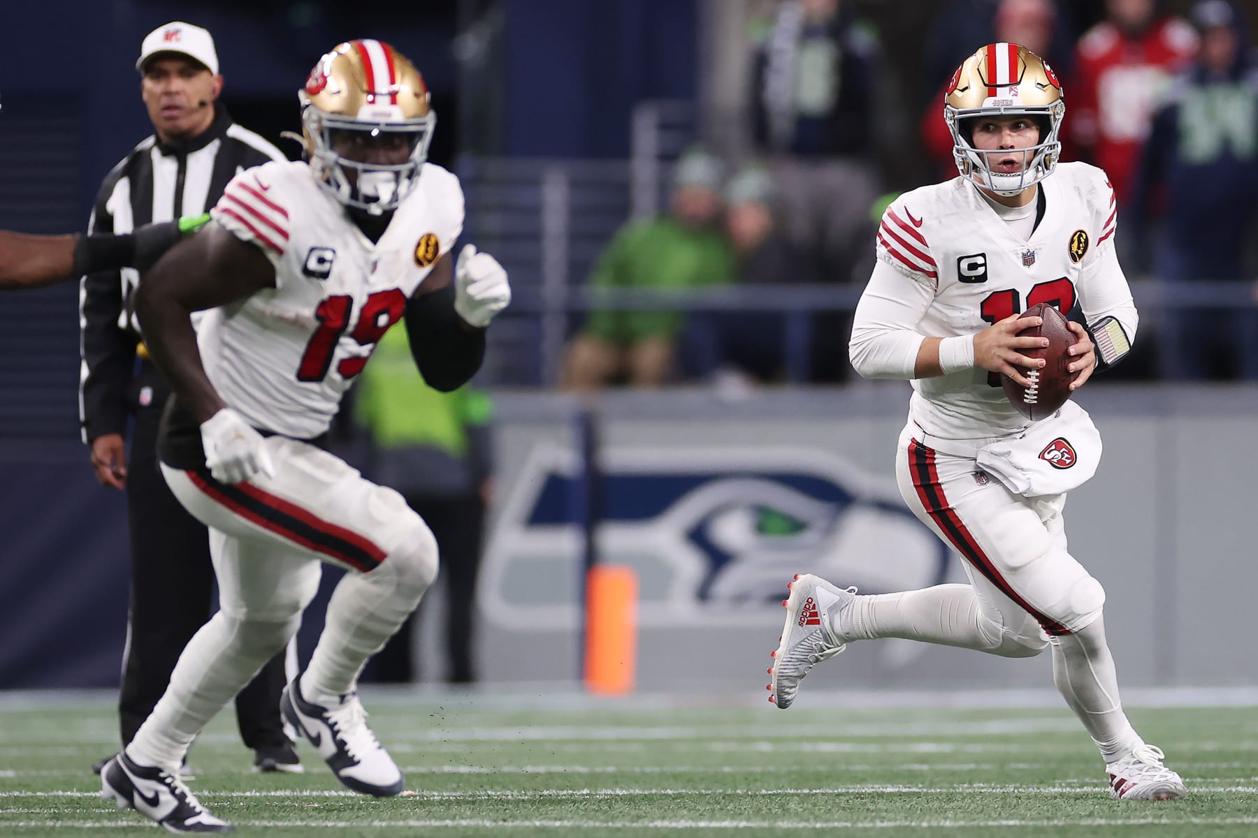 SEATTLE, WASHINGTON - NOVEMBER 23: Brock Purdy #13 of the San Francisco 49ers looks to pass during the fourth quarter against the Seattle Seahawks at Lumen Field on November 23, 2023 in Seattle, Washington. (Photo by Steph Chambers/Getty Images)