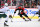 CALGARY, AB - DECEMBER 07: Calgary Flames Defenceman Noah Hanifin (55) skates up the ice with the puck during the third period of an NHL game between the Calgary Flames and the Minnesota Wild on December 7, 2022, at the Scotiabank Saddledome in Calgary, AB. (Photo by Brett Holmes/Icon Sportswire via Getty Images)