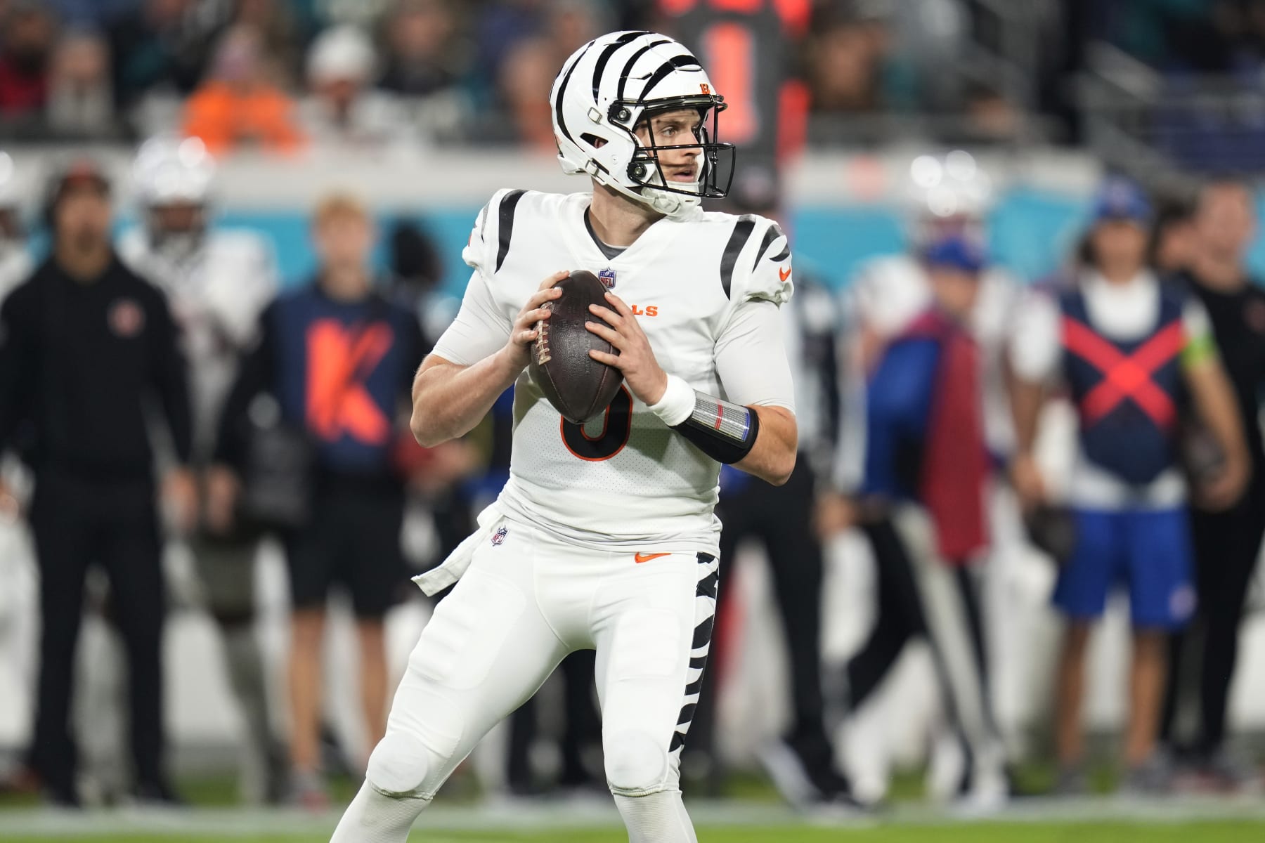 Cincinnati Bengals quarterback Jake Browning (6) looks for a receiver during the first half of an NFL football game against the Jacksonville Jaguars, Monday, Dec. 4, 2023, in Jacksonville, Fla. (AP Photo/John Raoux)