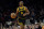 Golden State Warriors guard Chris Paul moves the ball up court against the Phoenix Suns during the first half of an NBA basketball game, Wednesday, Nov. 22, 2023, in Phoenix. (AP Photo/Matt York)