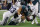 Dallas Cowboys safety Donovan Wilson, right, forces a fumble by Philadelphia Eagles quarterback Jalen Hurts, center, as teammate Damone Clark (33) helps apply pressure during the first half of an NFL football game, Sunday, Dec. 10, 2023, in Arlington, Texas. The Cowboys recovered the ball on the play. (AP Photo/Michael Ainsworth)