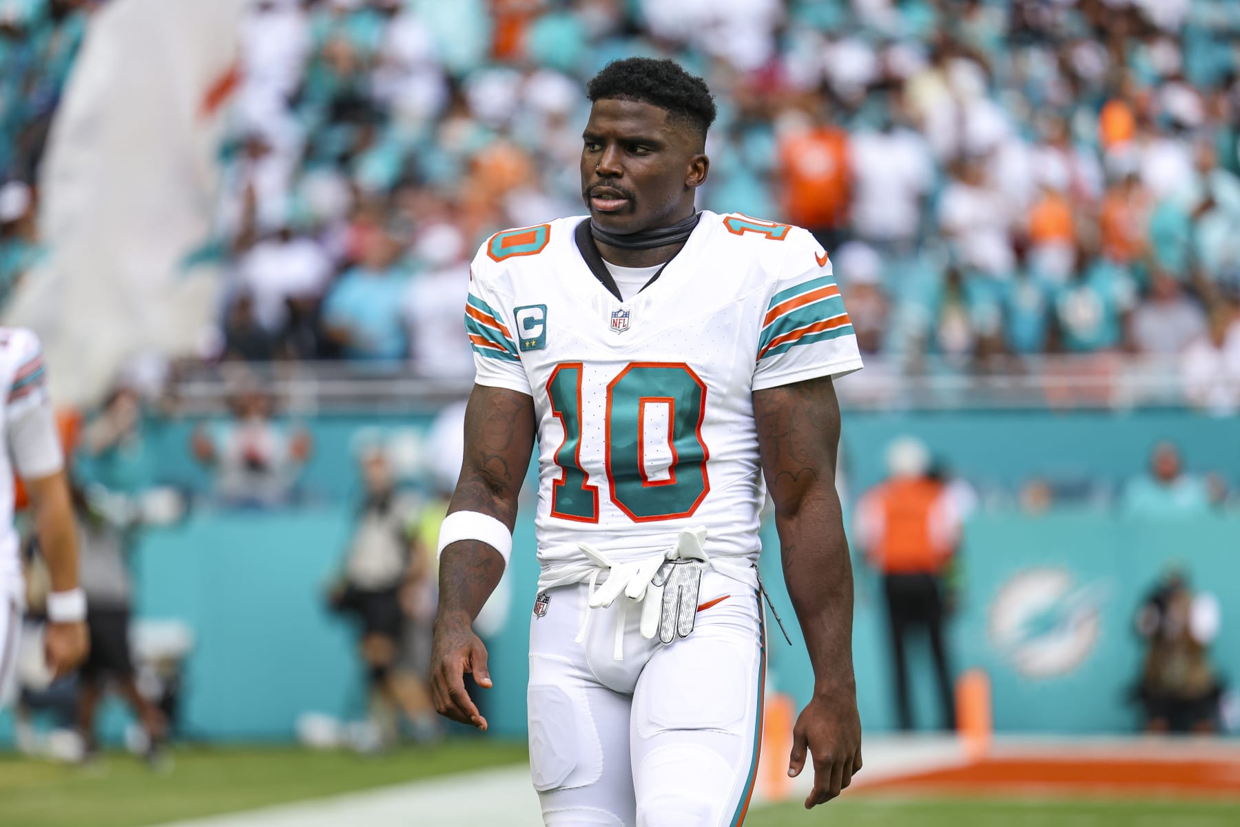 MIAMI GARDENS, FL - OCTOBER 29: Tyreek Hill #10 of the Miami Dolphins looks on from the field prior to an NFL football game against the New England Patriots at Hard Rock Stadium on October 29, 2023 in Miami Gardens, Florida. (Photo by Perry Knotts/Getty Images)