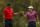 ORLANDO, FLORIDA - DECEMBER 17: Tiger Woods of the United States and son, Charlie Woods, react on the 15th green during the final round of the PNC Championship at The Ritz-Carlton Golf Club on December 17, 2023 in Orlando, Florida. (Photo by Mike Ehrmann/Getty Images)