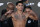 Ryan Garcia poses on the scale during a weigh-in Friday, April 21, 2023, in Las Vegas. Garcia is scheduled to fight Gervonta Davis in a catchweight boxing bout in Las Vegas on Saturday. (AP Photo/John Locher)