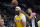 Los Angeles Lakers forward Anthony Davis (3) reacts after scoring over San Antonio Spurs center Victor Wembanyama (1) during the first half of an NBA basketball game in San Antonio, Wednesday, Dec. 13, 2023. (AP Photo/Eric Gay)