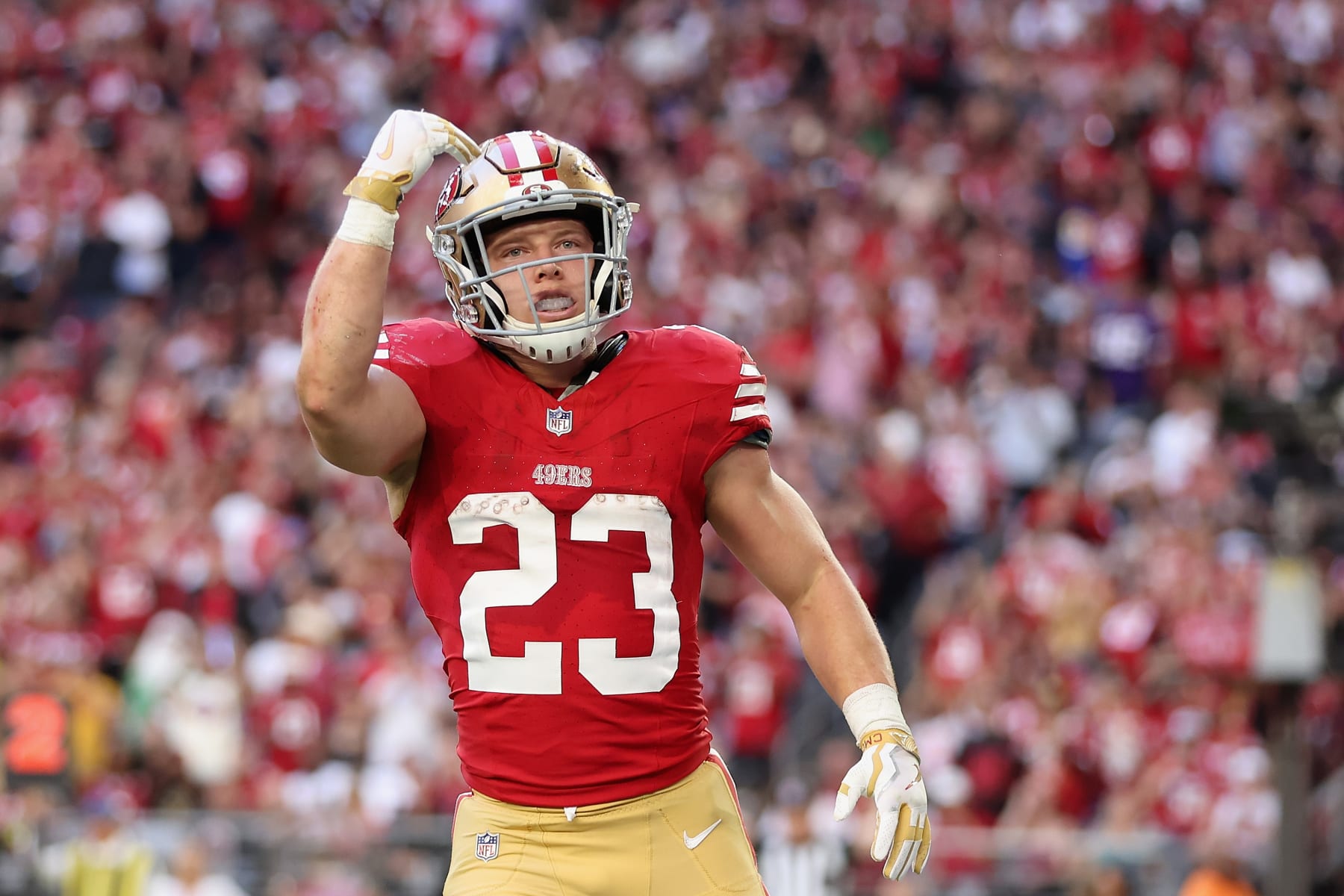 GLENDALE, ARIZONA - DECEMBER 17: Running back Christian McCaffrey #23 of the San Francisco 49ers celebrates after scoring a 5-yard rushing touchdown against the Arizona Cardinals during the second quarter of the NFL game at State Farm Stadium on December 17, 2023 in Glendale, Arizona. The 49ers defeated the Cardinals 45-29.  (Photo by Christian Petersen/Getty Images)