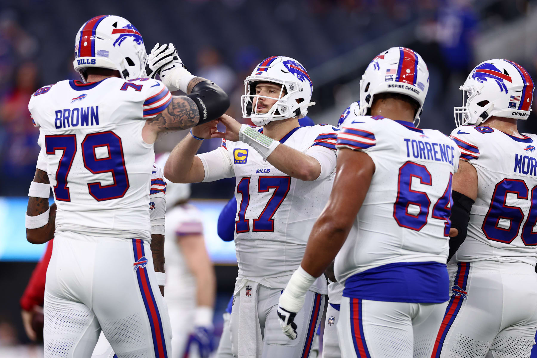 INGLEWOOD, CALIFORNIA - DECEMBER 23: Josh Allen #17 and Spencer Brown #79 of the Buffalo Bills warm ups prior to the game against the Los Angeles Chargers at SoFi Stadium on December 23, 2023 in Inglewood, California. (Photo by Katelyn Mulcahy/Getty Images)