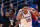LAWRENCE, KANSAS - DECEMBER 01: Kevin McCullar Jr. #15 of the Kansas Jayhawks reacts after making a three-pointer during the 2nd half of the game against the Connecticut Huskies at Allen Fieldhouse on December 01, 2023 in Lawrence, Kansas. (Photo by Jamie Squire/Getty Images)