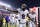 SANTA CLARA, CALIFORNIA - DECEMBER 25: Lamar Jackson #8 of the Baltimore Ravens high fives a fan while heading into the locker room after the first half against the San Francisco 49ers at Levi's Stadium on December 25, 2023 in Santa Clara, California. (Photo by Loren Elliott/Getty Images)