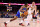 DENVER, COLORADO - DECEMBER 25: Jonathan Kuminga #00 of the Golden State Warriors drives against Nikola Jokic #15 of the Denver Nuggets at Ball Arena on December 25, 2023 in Denver, Colorado. NOTE TO USER: User expressly acknowledges and agrees that, by downloading and/or using this Photograph, user is consenting to the terms and conditions of the Getty Images License Agreement. (Photo by Jamie Schwaberow/Getty Images)