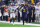 HOUSTON, TEXAS - JANUARY 08: Blake Corum #2 of the Michigan Wolverines runs the ball against Thaddeus Dixon #9 of the Washington Huskies in the first half during the 2024 CFP National Championship game at NRG Stadium on January 08, 2024 in Houston, Texas. (Photo by Stacy Revere/Getty Images)