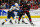 RALEIGH, NORTH CAROLINA - JANUARY 06: Jordan Staal #11 of the Carolina Hurricanes shoots the puck while defended by Jake Neighbours #63 of the St. Louis Blues in the second period during their game at PNC Arena on January 06, 2024 in Raleigh, North Carolina. (Photo by Jacob Kupferman/Getty Images)