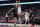 DALLAS, TEXAS - JANUARY 24: Devin Booker #1 of the Phoenix Suns shoots as Maxi Kleber #42 (L) of the Dallas Mavericks defends during the first half at American Airlines Center on January 24, 2024 in Dallas, Texas. NOTE TO USER: User expressly acknowledges and agrees that, by downloading and or using this photograph, User is consenting to the terms and conditions of the Getty Images License Agreement. (Photo by Sam Hodde/Getty Images)