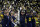 HOUSTON, TX - JANUARY 08: Head Coach Jim Harbaugh of the Michigan Wolverines lifts the National Championship trophy during the Michigan Wolverines versus the Washington Huskies CFP National Championship game on January 8, 2024, at NRG Stadium in Houston, TX. (Photo by Leslie Plaza Johnson/Icon Sportswire via Getty Images)