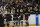 BOSTON, MASSACHUSETTS - FEBRUARY 8: Pavel Zacha #18, David Pastrnak #88 and Charlie McAvoy #73 of the Boston Bruins smile after the second-period goal against the Vancouver Canucks at the TD Garden on February 8, 2024 in Boston, Massachusetts. (Photo by Steve Babineau/NHLI via Getty Images)