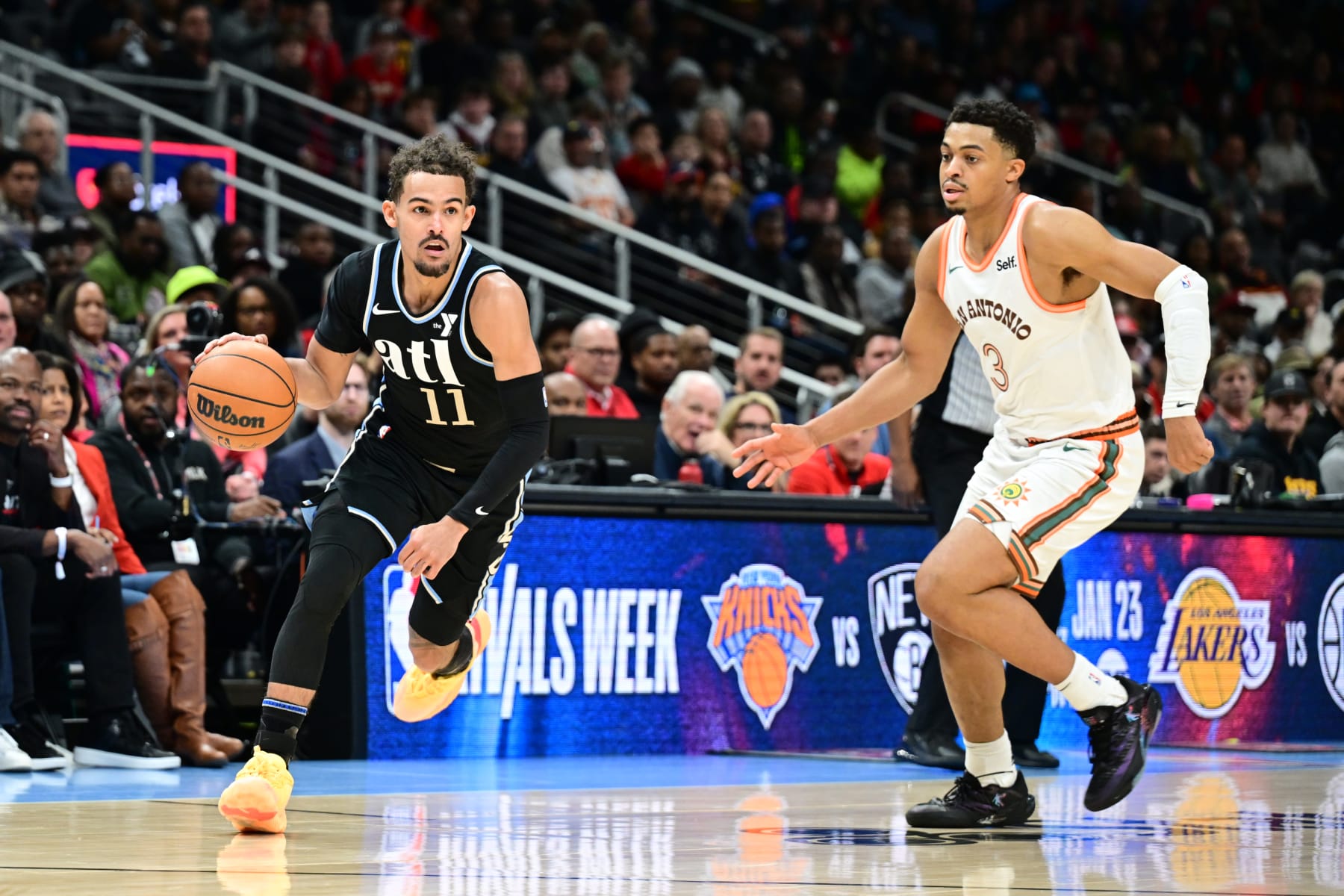 ATLANTA, GA - JANUARY 15: Trae Young #11 of the Atlanta Hawks dribbles the ball during the game against the San Antonio Spurs on January 15, 2024 at State Farm Arena in Atlanta, Georgia.  NOTE TO USER: User expressly acknowledges and agrees that, by downloading and/or using this Photograph, user is consenting to the terms and conditions of the Getty Images License Agreement. Mandatory Copyright Notice: Copyright 2024 NBAE (Photo by Adam Hagy/NBAE via Getty Images)