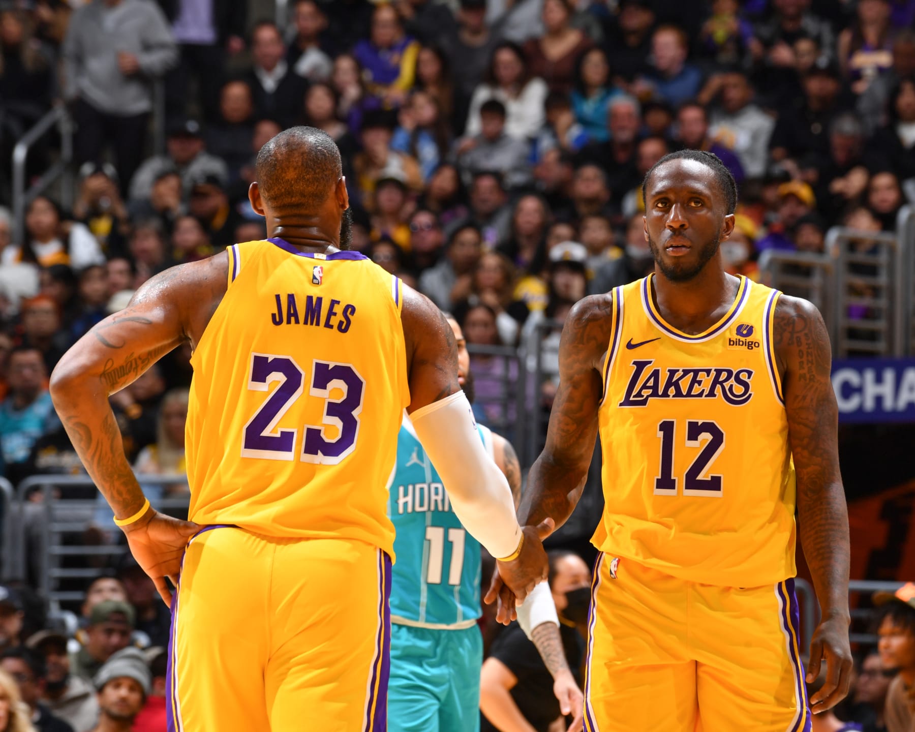 LOS ANGELES, CA - DECEMBER 28:  LeBron James #23 of the Los Angeles Lakers & Taurean Prince #12 of the Los Angeles Lakers high five during the game  on December 28, 2023 at Crypto.Com Arena in Los Angeles, California. NOTE TO USER: User expressly acknowledges and agrees that, by downloading and/or using this Photograph, user is consenting to the terms and conditions of the Getty Images License Agreement. Mandatory Copyright Notice: Copyright 2023 NBAE (Photo by Juan Ocampo/NBAE via Getty Images)