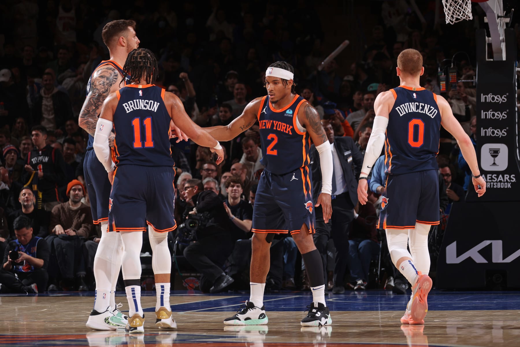 NEW YORK, NY - FEBRUARY 1: Miles McBride #2 high fives Jalen Brunson #11 of the New York Knicks during the game against the Indiana Pacers on February 1, 2024 at Madison Square Garden in New York City, New York.  NOTE TO USER: User expressly acknowledges and agrees that, by downloading and or using this photograph, User is consenting to the terms and conditions of the Getty Images License Agreement. Mandatory Copyright Notice: Copyright 2024 NBAE  (Photo by Nathaniel S. Butler/NBAE via Getty Images)