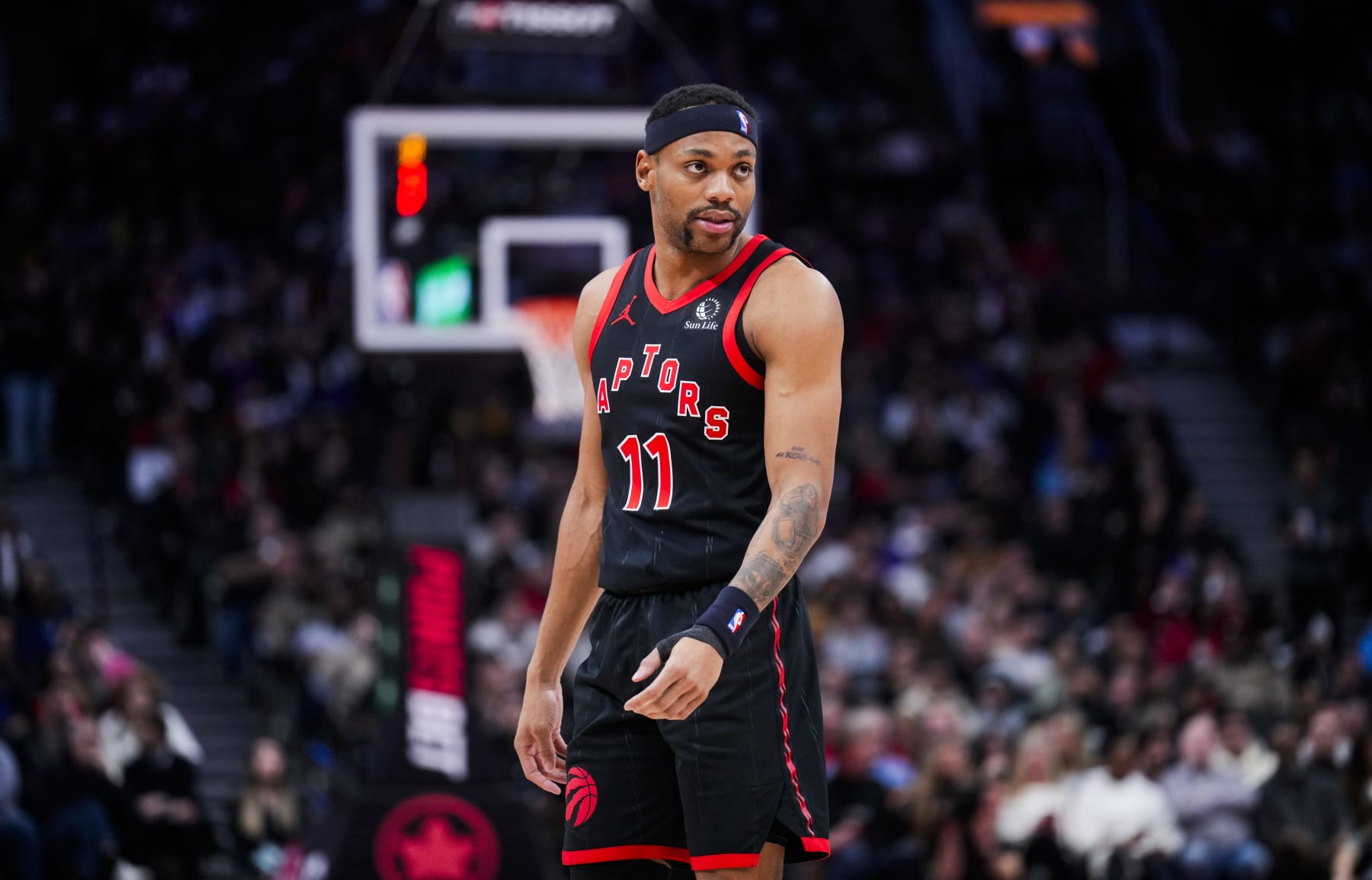 TORONTO, ON - FEBRUARY 9: Bruce Brown #11 of the Toronto Raptors looks on against the Houston Rockets during the second half of their basketball game at the Scotiabank Arena on February 9, 2024 in Toronto, Ontario, Canada. NOTE TO USER: User expressly acknowledges and agrees that, by downloading and/or using this Photograph, user is consenting to the terms and conditions of the Getty Images License Agreement. (Photo by Mark Blinch/Getty Images)