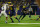 HOUSTON, TX - JANUARY 08: Michigan Wolverines running back Donovan Edwards (7) cuts through a hole and runs for a second touchdown during the CFP National Championship game Michigan Wolverines and Washington Huskies on January 8, 2024, at NRG Stadium in Houston, Texas. (Photo by David Buono/Icon Sportswire via Getty Images)