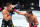MIAMI, FLORIDA - MARCH 09: (R-L) CJ Vergara punches Asu Almabayev of Kazakstan in a flyweight fight during the UFC 299 event at Kaseya Center on March 09, 2024 in Miami, Florida. (Photo by Chris Unger/Zuffa LLC via Getty Images)