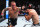 MIAMI, FLORIDA - MARCH 09: (L-R) Dustin Poirier punches Benoit Saint Denis of France in a lightweight fight during the UFC 299 event at Kaseya Center on March 09, 2024 in Miami, Florida. (Photo by Chris Unger/Zuffa LLC via Getty Images)