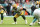 MIAMI GARDENS, FL - DECEMBER 25: Jon Runyan #76 of the Green Bay Packers blocks during an NFL football game against the Miami Dolphins, Sunday at Hard Rock Stadium on December 25, 2023 in Miami Gardens, Florida. (Photo by Kevin Sabitus/Getty Images)